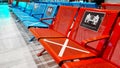 Airport Lounge, Seating Benches Lined Through One Seat. Social distancing, safety measures in the era of coronavirus Royalty Free Stock Photo