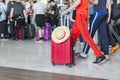 Airport luggage Trolley with suitcases, unidentified man woman walking in the airport, station, France. Royalty Free Stock Photo