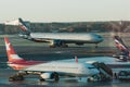 Airport with many airplanes at beautiful sunset Royalty Free Stock Photo