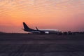 Airport with many airplanes at beautiful sunset Royalty Free Stock Photo