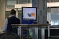 Airport, munich, germany, 2019 april 09: monitor with x-ray of luggage Royalty Free Stock Photo