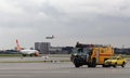 Airport ramp scene with emergency vehicles