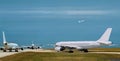 Busy airport, airplanes in runway queue