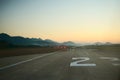 Airport runway at dawn. Travel, air transport, aeronautical industry concept