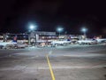 Airport runway with some airplanes, at night Royalty Free Stock Photo