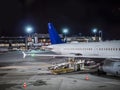 Airport runway with some airplanes, at night Royalty Free Stock Photo