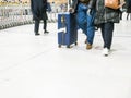 Airport rush. people with their suitcases walking along a corridor Royalty Free Stock Photo