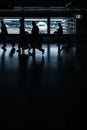 Airport rush: people with their suitcases walking along a corridor Royalty Free Stock Photo