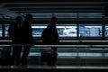 Airport rush: people with their suitcases walking along a corridor Royalty Free Stock Photo