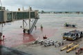 Airport's staff working on security check on a bad weather