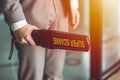 Airport security guard officer with metal scanner or weapon detector at check point at passenger gate Royalty Free Stock Photo