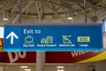 Airport sign board Ground Transport Admirals Club Lounge Baggage Claim in air terminal Royalty Free Stock Photo