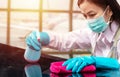 Airport staff wearing hygienic face mask make cleaning and disinfection for good hygiene around airport Royalty Free Stock Photo