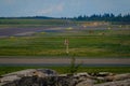 An airport tarmac with a windsock. Runway markings and lights Royalty Free Stock Photo