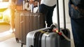 Airport taxi. passenger with big roller luggage standing on the line waiting for taxi queue at taxi parking lot Royalty Free Stock Photo