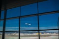 Airport Terminal and AirplaneTaking off in Blue Sky Royalty Free Stock Photo