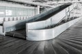 Airport terminal baggage carousel. Baggage conveyor belt in empty airport terminal. Old abandoned airport terminal. Royalty Free Stock Photo