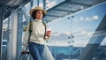 Airport Terminal: Black Woman Holds Ticket, in a Hurry is Late and Runs Through Airline Hub to the Royalty Free Stock Photo