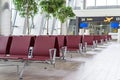 Airport terminal, empty waiting chairs near gate Royalty Free Stock Photo