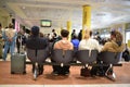 Airport terminal filled with travelers awaiting their flight Royalty Free Stock Photo