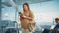 Airport Terminal: Happy Traveling Caucasian Woman Waiting at Flight Gates for Plane Boarding, Uses Royalty Free Stock Photo