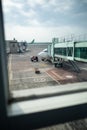 Airport terminal scene. Passanger cargo being carried at airplane dock. Royalty Free Stock Photo