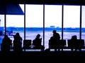 Airport terminal , Silhouettes of business people traveling on airport; waiting at the plane boarding gates Royalty Free Stock Photo