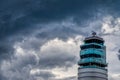 Airport traffic control tower at vienna International Airport on a dark cloud. Austria Royalty Free Stock Photo