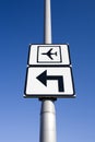 Airport traffic sign with arrow pointing left against blue sky Royalty Free Stock Photo