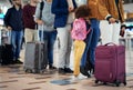 Airport, travel and people legs in queue for international vacation, holiday or immigration. Line, group and waiting Royalty Free Stock Photo