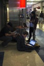 Airport travelers charging their battaries for computers, ipad and cell phones, airport