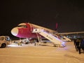 Airport in Tromso - approaching the Aircraft at night - everything covered in snÃÂ³w, even the aircraft