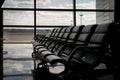 airport waiting area , seats and outside the window scene Royalty Free Stock Photo