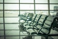 Airport waiting area , seats and outside the window scene Royalty Free Stock Photo