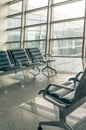 Airport waiting area, seats and outside the window Royalty Free Stock Photo