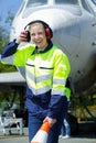 Airport worker with airplane on background