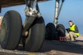 Airport worker checking chassis