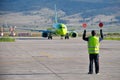 Airport worker directing