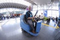 Airport worker driving electric floor cleaning machine in the Boryspil airport terminal. Ukraine