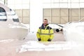 Airport workers check an aircraft for safety in a hangar