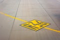 Airport yellow taxiway lines R36 markings on the apron on concrete asphalt, sign for airplane pilots Royalty Free Stock Photo