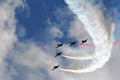 Airshow planes group with smoke against the blue sky Royalty Free Stock Photo