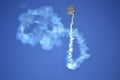 Airshow skydivers white smoke figures