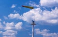 Airsock with signal mast on blue sky