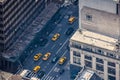 Airstrip of New York City, with buildings and streets filled with the famous yellow taxis during the day. Concept of travel and