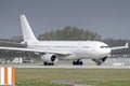 AirTanker Airbus A330-243 with the aircraft registration G-VYGM is starting on the southern runway 8R of the Munich airport MUC Royalty Free Stock Photo