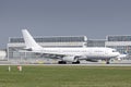 AirTanker Airbus A330-243 with the aircraft registration G-VYGM is starting on the southern runway 8R of the Munich airport MUC Royalty Free Stock Photo