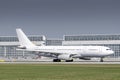 AirTanker Airbus A330-243 with the aircraft registration G-VYGM is starting on the southern runway 8R of the Munich airport MUC Royalty Free Stock Photo