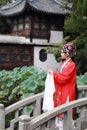 Aisa Chinese woman Peking Beijing Opera Costumes Pavilion garden China traditional role drama play bride dance perform fan ancient Royalty Free Stock Photo