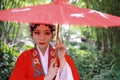 Aisa Chinese woman Peking Beijing Opera Costumes Pavilion garden China traditional role drama play bride hold red Umbrella Royalty Free Stock Photo